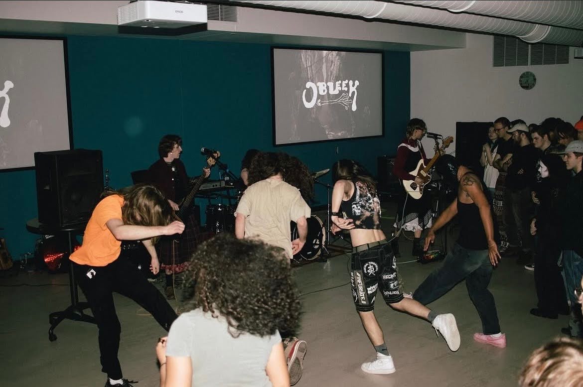 Student-led band Obleek performing for students in the rafters of the Kirby Student Center at UMD.