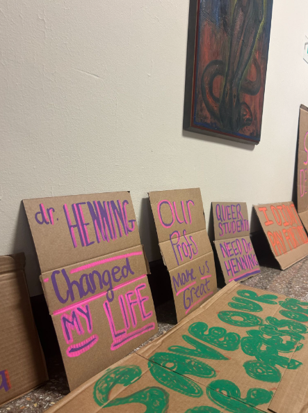 Signs line the second floor hallway.